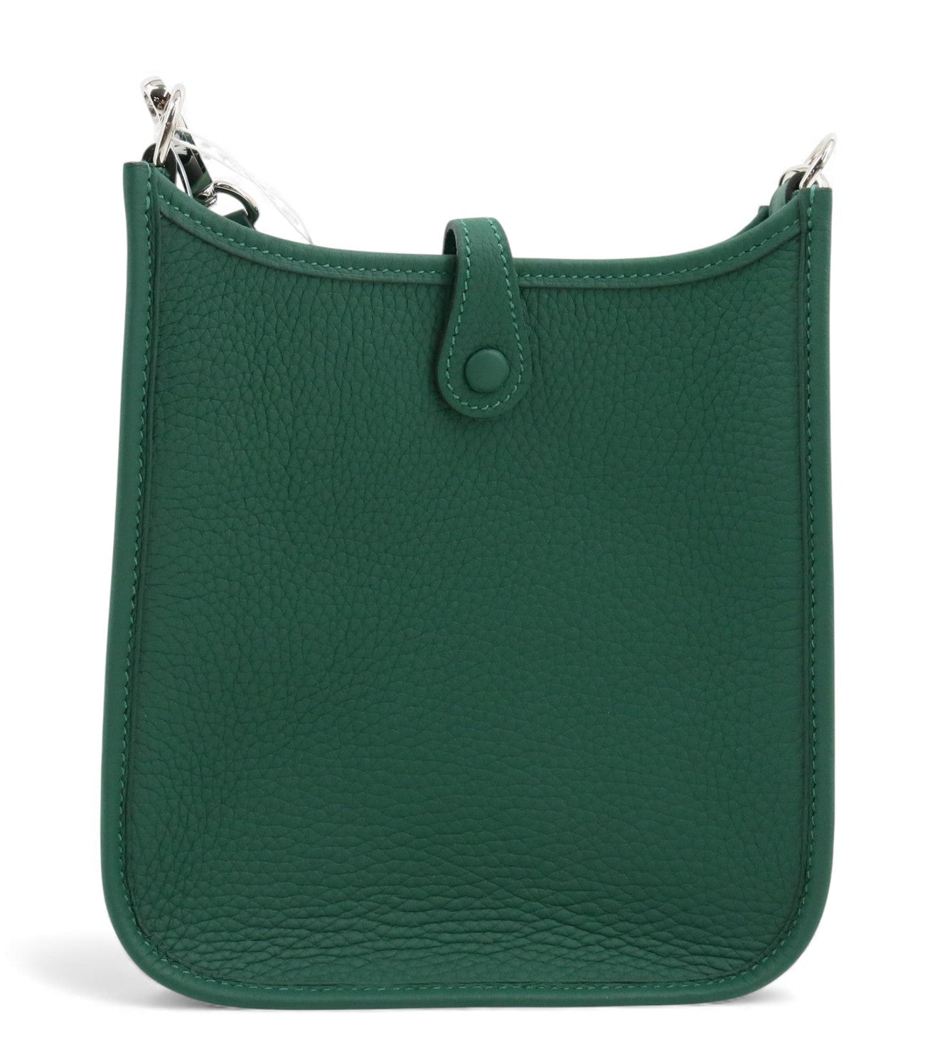 Green leather handbag with a strap on a white background