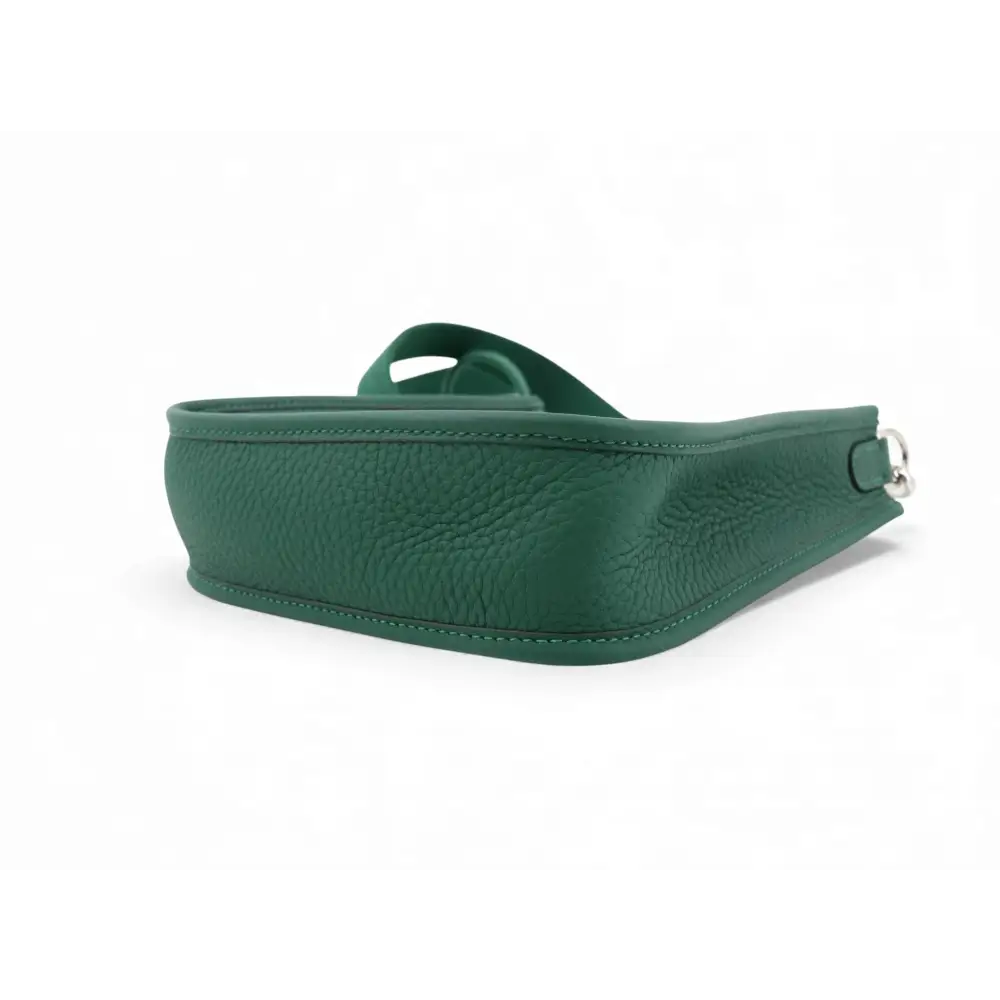 Green leather belt on a white background