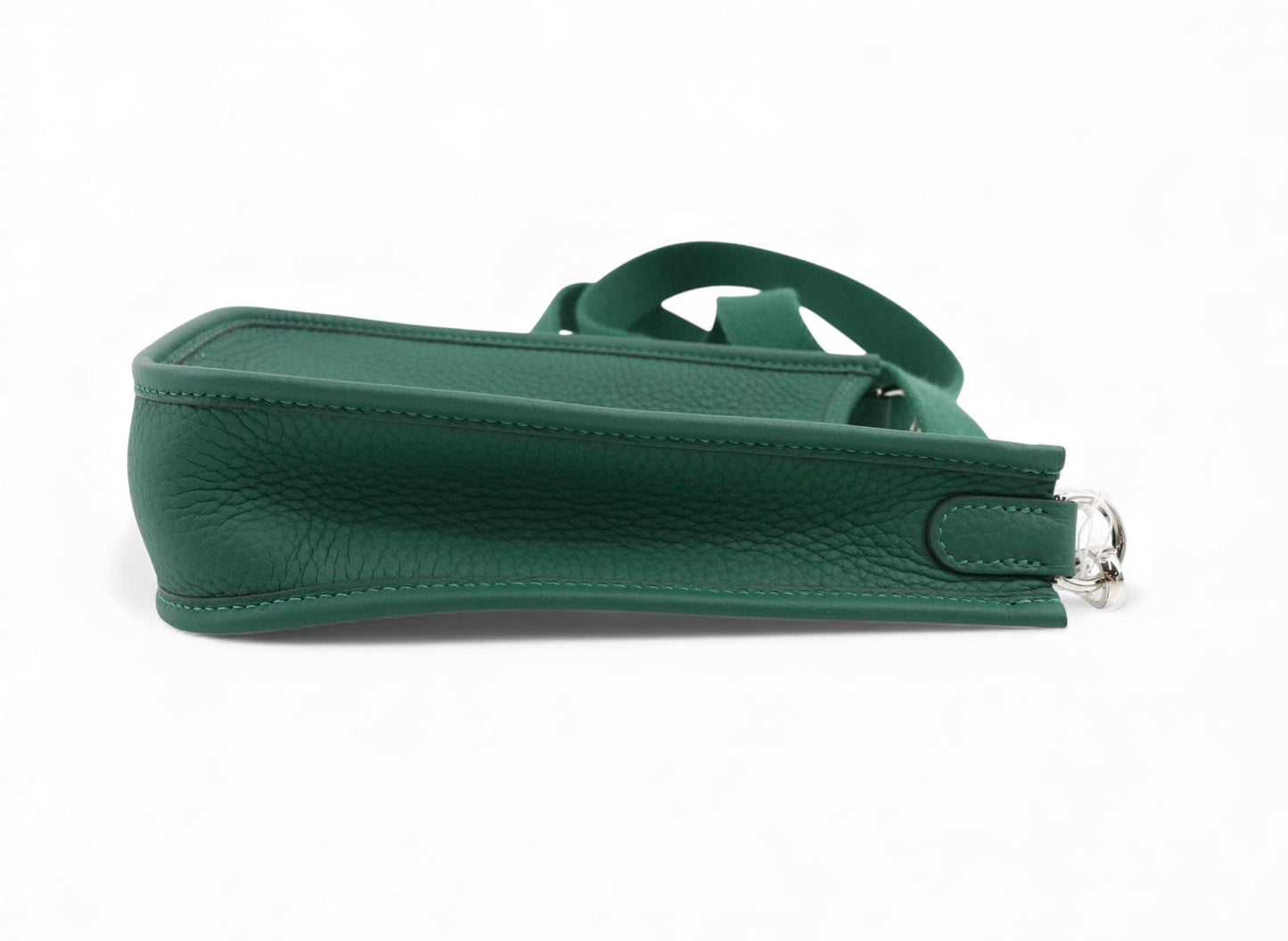 Green handbag with a strap on a white background