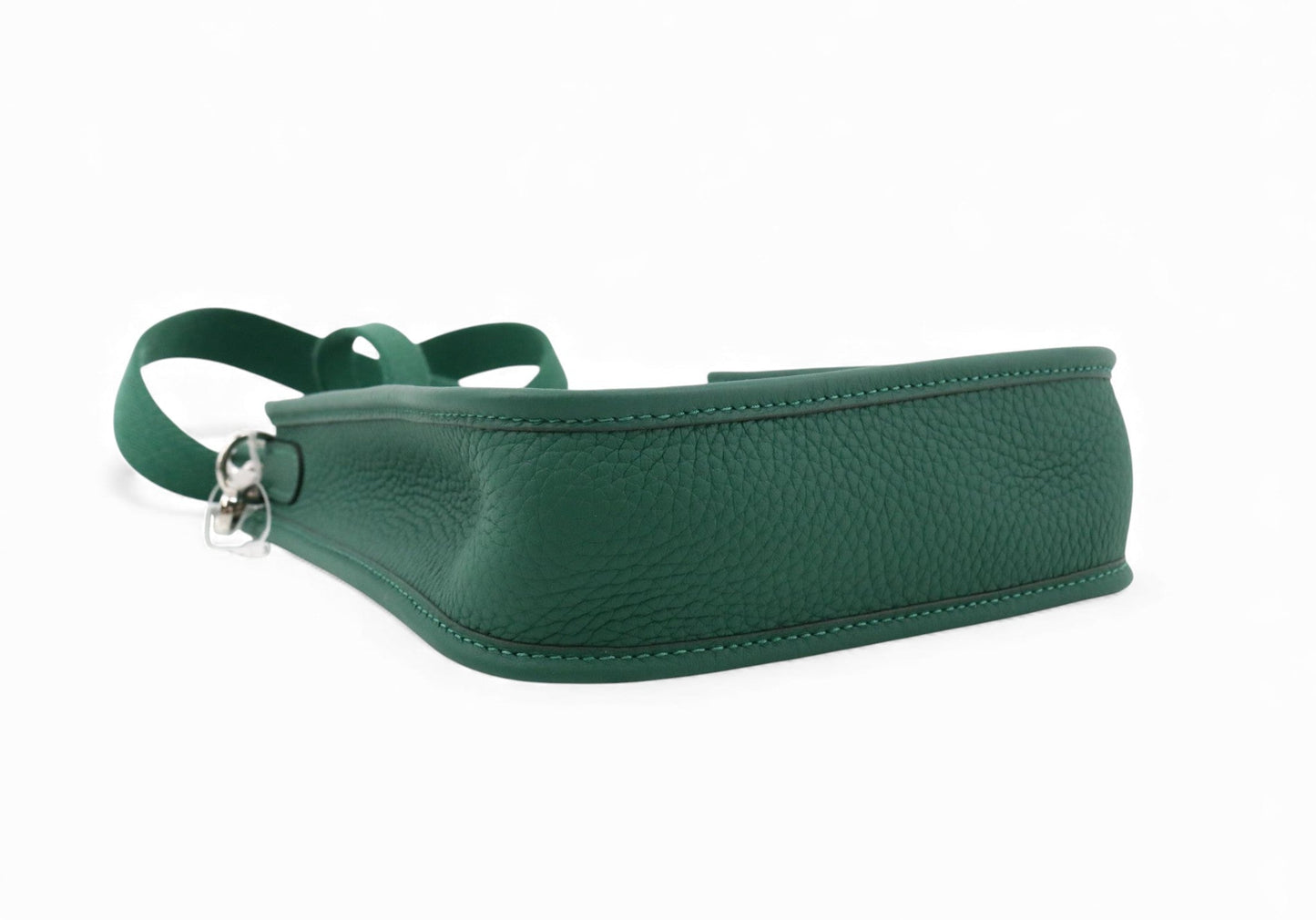 Green leather belt with a silver buckle on a white background