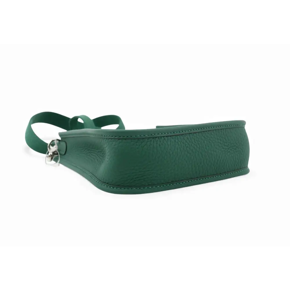 Green leather belt with a silver buckle on a white background