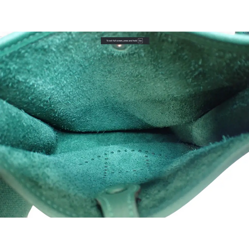 Load image 1 in gallery view. Close-up of a green textured object with a white background