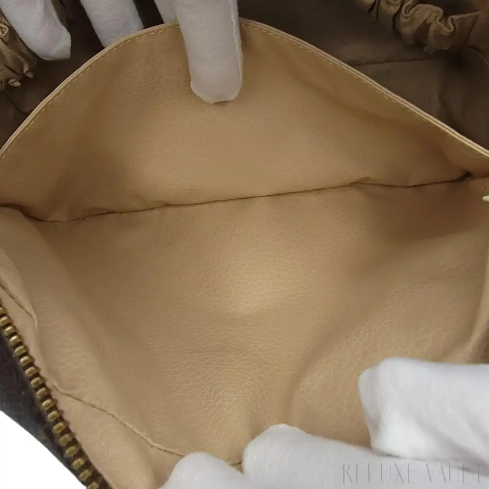 Monogram Trousse Toilette 23